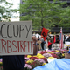 Illustration for article titled "Radiohead Wouldn't Play In The Big East Either": Occupy Wall Street Has An "Occupy Herbstreit" Photobomber